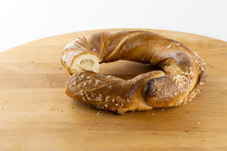 International pretzel holiday, pretzel days, Krakow pretzels, cutting pretzels, pretzels on a white...