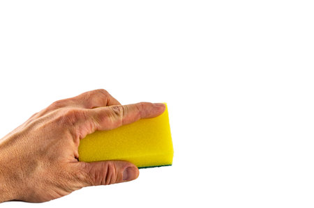 Washing dishes, colorful sponges for washing dishes on a white backgroundの写真素材