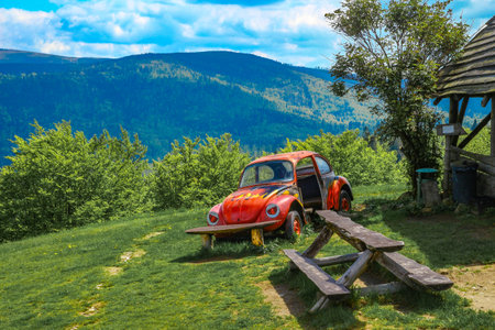 Mountain landscape - panorama of mountains, mountain shelter in the Silesian Beskids, TelesforÃ³wka, wreck of an old abandoned car as an attraction for touristsの写真素材
