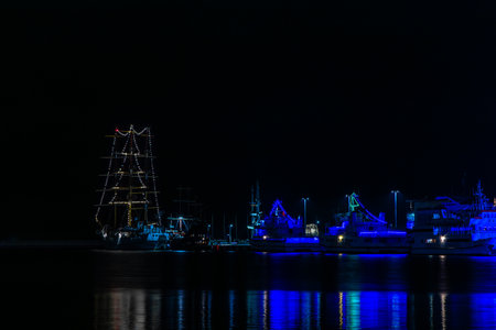 Port quay in Gdynia at night, illuminated ships, city at night, Christmas decorations, city...