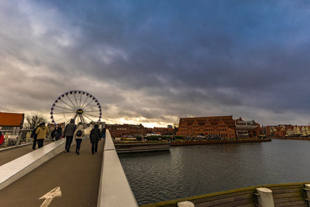 The center of the old town of GdaÅsk, a walk along the Motlawa River, historic tenement houses, a market, a medieval craneの写真素材