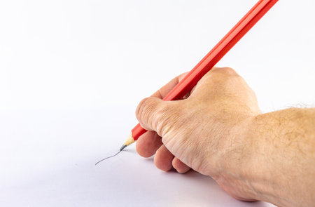 Big red pencil in man's hands, pencil drawing on white paper, graphic design, handwriting