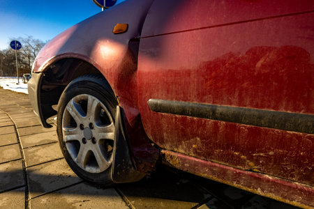 damaged vehicle on the side of the road, broken wheel, no car insuranceの写真素材