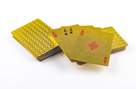 Gold colored poker playing cards, deck of cards on white background, gold cards