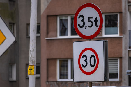 Sign informing about the speed limit for motor vehicles in the city, maximum speed 30 kilometers per...