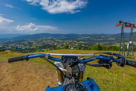 Handlebar of a motocross bike, riding a bike in the mountains