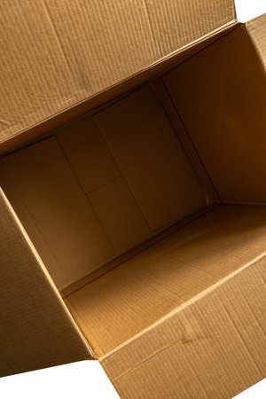 Empty open gray cardboard box, box on white background, open empty after packageの写真素材