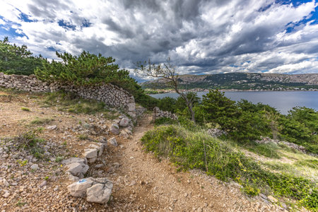 A walk along the rocky road from the beach in Baska to the top of Mount Bag, a panorama of the city seen from aboveの写真素材
