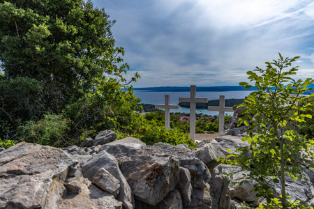 The Three Crosses Sanctuary on the hill in Punat, entrance via a steep rocky path to the temple,...