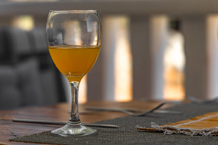 Orange juice poured into a glass placed on the table, a refreshing carbonated drink in a glassの写真素材