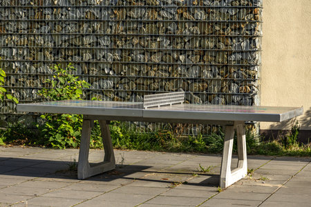 Concrete ping pong table in the city park,