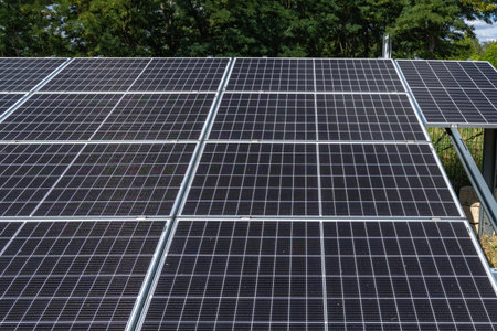 Photovoltaic solar panels installed in front of the house in the garden, drawing solar energy...