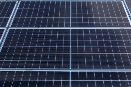 Photovoltaic solar panels installed in front of the house in the garden, drawing solar energy...