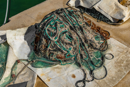Colorful fishing nets drying in the port, fishing nets being repaired after fishing, fishing ropes and lines Croatiaの写真素材