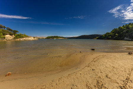 Sandy beach, shallow water of the Adriatic Sea Rab Strucic Dubac Croatiaの写真素材