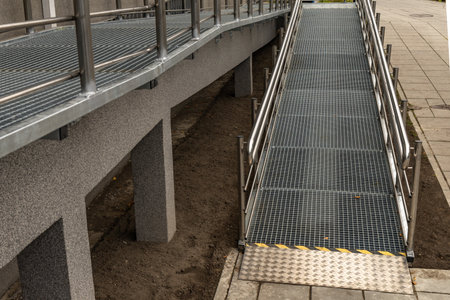 Accessible ramp for disabled people, metal ramp with handrails for strollers and disabled people,...