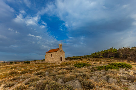 Sunset Votive Church of St. Nicholas built in 1447, sanctuary on the island of Rab, Cape Sorinja, church renovated in 2012の写真素材