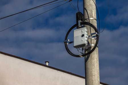 High-speed internet connection, fiber-optic internet network, pole with power lineの写真素材