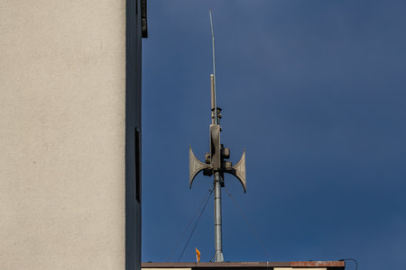 An alarm siren mounted on the roof of a building, the siren emits a signal warning of an air raid in Polandの写真素材