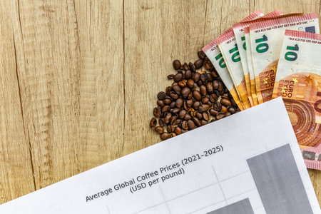 Top view of coffee beans, euro banknotes, and financial chart on wooden table. Symbol of rising coffee prices, inflation, and global market trends in coffee trade and economy.の写真素材