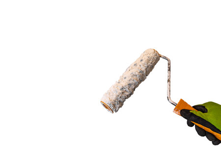 Paint roller in hand isolated on white background with clipping path.の写真素材