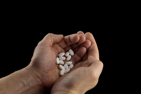 Doctors prescription pills in man's hands, pill countingの写真素材
