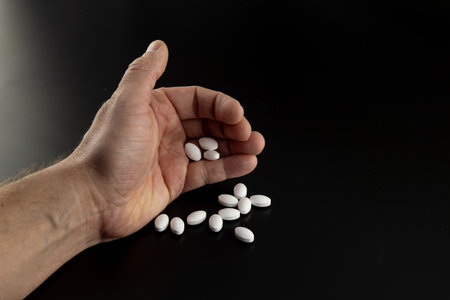 Doctors prescription pills in man's hands, pill countingの写真素材
