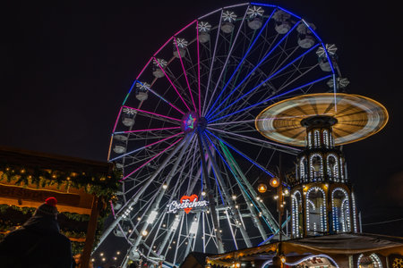 Czestochowa, Poland, December 21, 2025 - BiegaÅskiego Square, the large illuminated Ferris wheel, as an attraction for residents, light illumination in the cityの写真素材