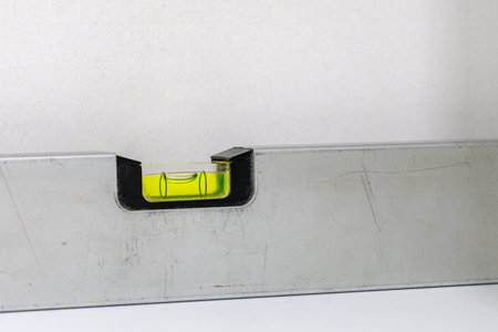 An aluminum spirit level checking the level and plumbness
