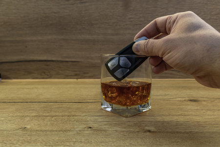 Man throws keys to luxury car into glass of alcohol with ice, driver quits addiction, alcohol abuse...