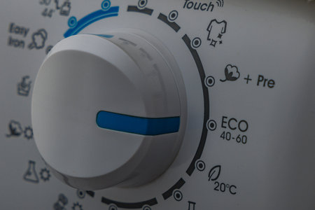 Machine wash, eco-friendly program, saving energy and water, thermostat knob for automatic washing machine, high water consumption during machine washの写真素材