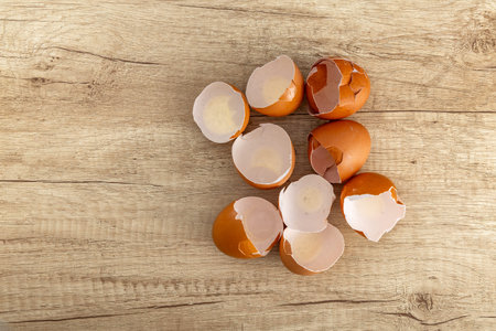 Chicken eggshells placed on a wooden counter