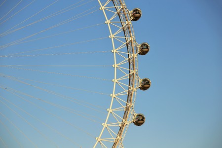London, UK, 26/04/2016. Detail of the London Eye with the Moon on the background in a vintage toneのeditorial素材