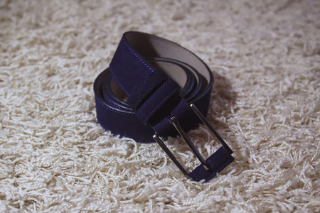 Wedding men's belt, lying on the floorの写真素材