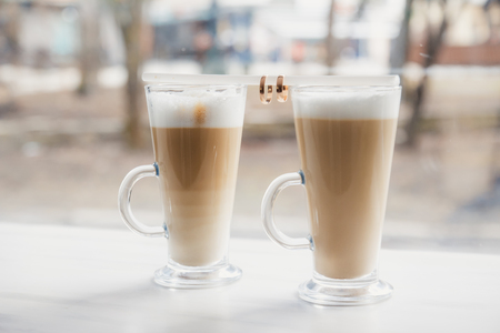 Two cups of coffee on a wooden table, a declaration of loveの写真素材