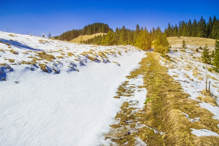 Landscape from the rocky Fagaras mountains in Romania in the summer with Capra lake in the distanceの写真素材