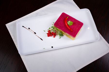 Meat galantine with vegetables, beautiful decoration aspic for festive meal selective focusの写真素材