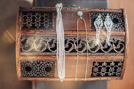 Vintage women's jewelry and gloves. Retro concept on a wooden backgroundの写真素材