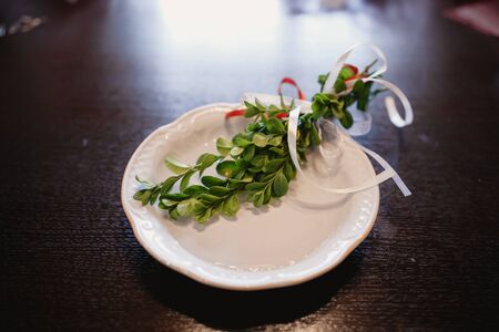 Original wedding floral decoration in the form of mini-vases and bouquets of flowers hanging from the ceilingの写真素材