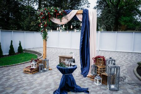 Wedding archway with flowers arranged in park for a wedding ceremony in wedding dayの写真素材
