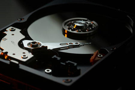 Close up of hard disk drive on black background. Selective focus.