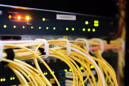 close up of network cables connected to switch and ethernet cables in data center