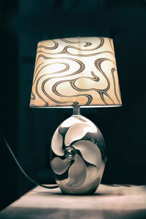 Vintage lamp on the table in the dark room.の写真素材