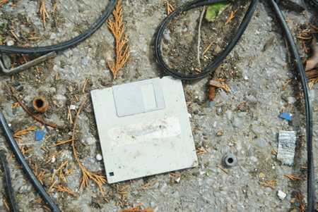 Old and dirty electrical equipment on the ground. Selective focus.