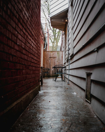 A narrow street in a small town during winter.の写真素材