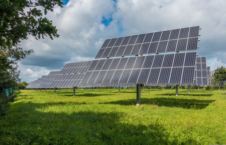 Solar panels installed on a green field. Photovoltaic modules for innovation green energy.