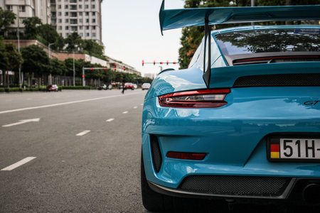 Rear view of a blue car in Berlin, Germany.