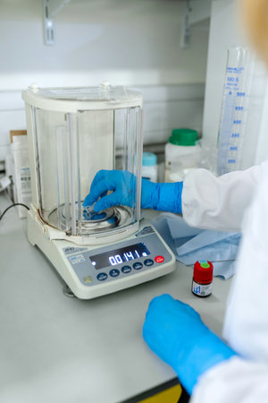 Closeup of a laboratory assistant preparing a sample