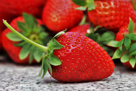 Strawberries on wooden table, close-up, selective focusの写真素材
