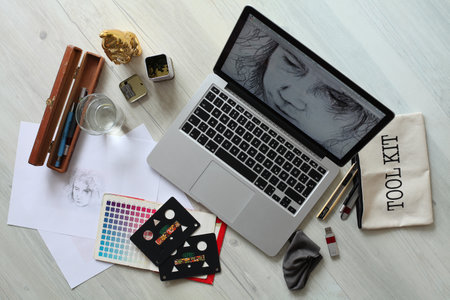 Flat lay composition with laptop, cards and cosmetics on wooden tableの写真素材